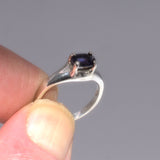 silver ring with violet blue gemstone