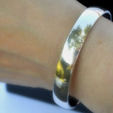 silver D-profile open cuff bangle on wrist