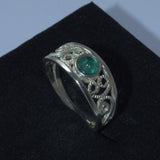 Emerald and silver openwork ring