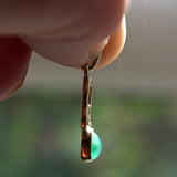 Emerald and 9ct gold pendant side view