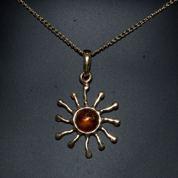 solid 9ct gold Amber sun pendant