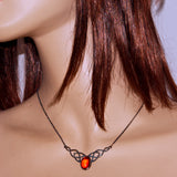Amber and solid 925 silver Celtic pendant necklace shown on model
