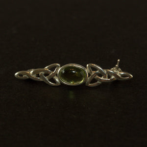 Peridot and silver Celtic style brooch