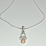 silver Celtic pendant featuring an Opal