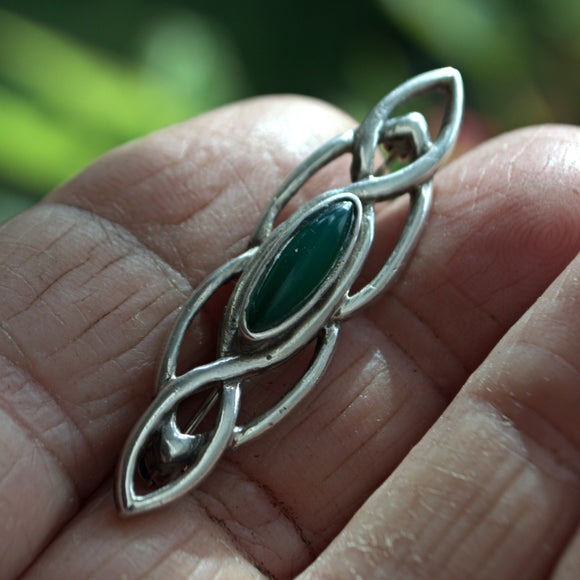 silver Celtic bar brooch with green stone
