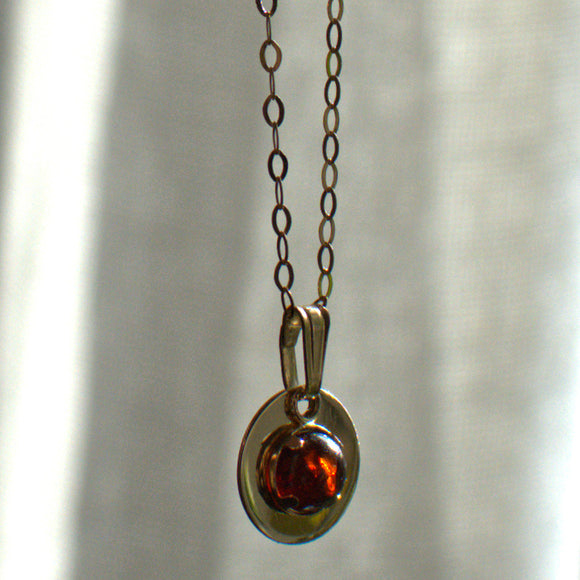 Garnet 9ct gold disc pendant necklace