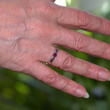 Garnet solid silver textured open ring shown on finger