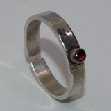 Garnet and textured silver open ring