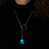 solid silver lariat with Labradorite gemstone, shown on model