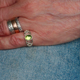 Celtic silver Peridot ring shown on finger