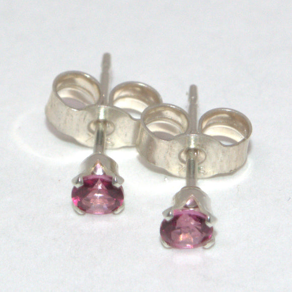 silver stud earrings featuring Pink Topaz