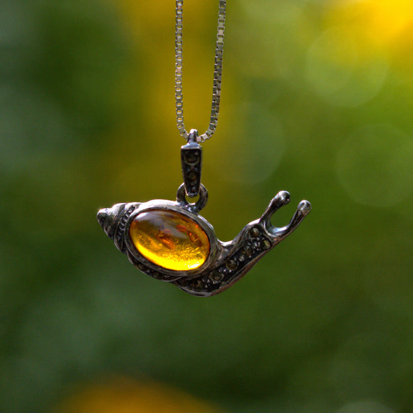vintage Amber and silver snail pendant