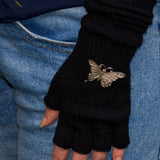 silver butterfly brooch displayed on a scrunch glove