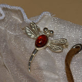 silver dragonfly brooch pinned on models blouse