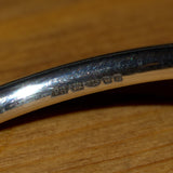 hallmarked Garnet and silver bangle