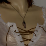silver nature necklace shown on model
