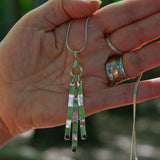 solid silver triple drop pendant necklace featuring three Sapphire gemstones