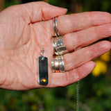 dark Citrine solid sterling silver oblong pendant necklace shown in hand