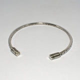 silver hand patterned open bangle