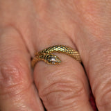 silver and gold plate snake ring on finger