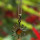 Amber and solid gold sun pendant necklace