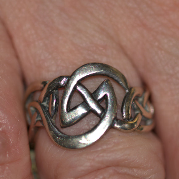 Celtic solid silver knotwork ring shown on finger