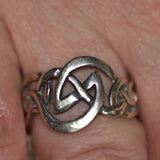 Celtic solid silver knotwork ring shown on finger