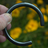 hand forged fine textured solid silver bangle