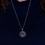 solid silver coiled snake pendant necklace shown on model
