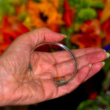 flat ends solid sterling silver open bangle shown in hand