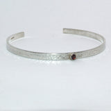 textured silver and Garnet open bangle