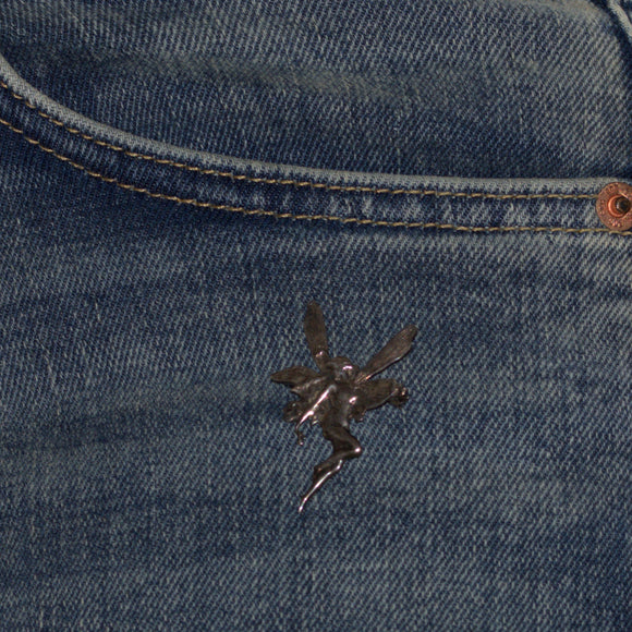 vintage 925 faery brooch pinned on front jeans pocket