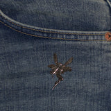 vintage 925 faery brooch pinned on front jeans pocket