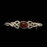 Amber and silver Celtic brooch