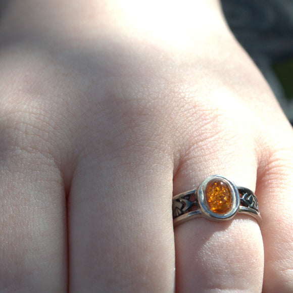 Amber and silver Celtic design ring