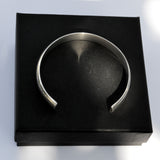 silver D-profile open bangle on gift box