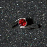 Garnet silver crossover ring