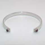 Garnet terminals open silver bangle