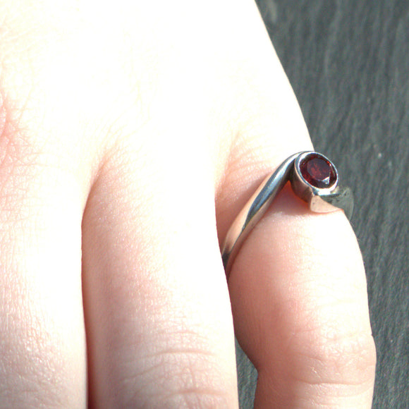 silver and Garnet crossover ring