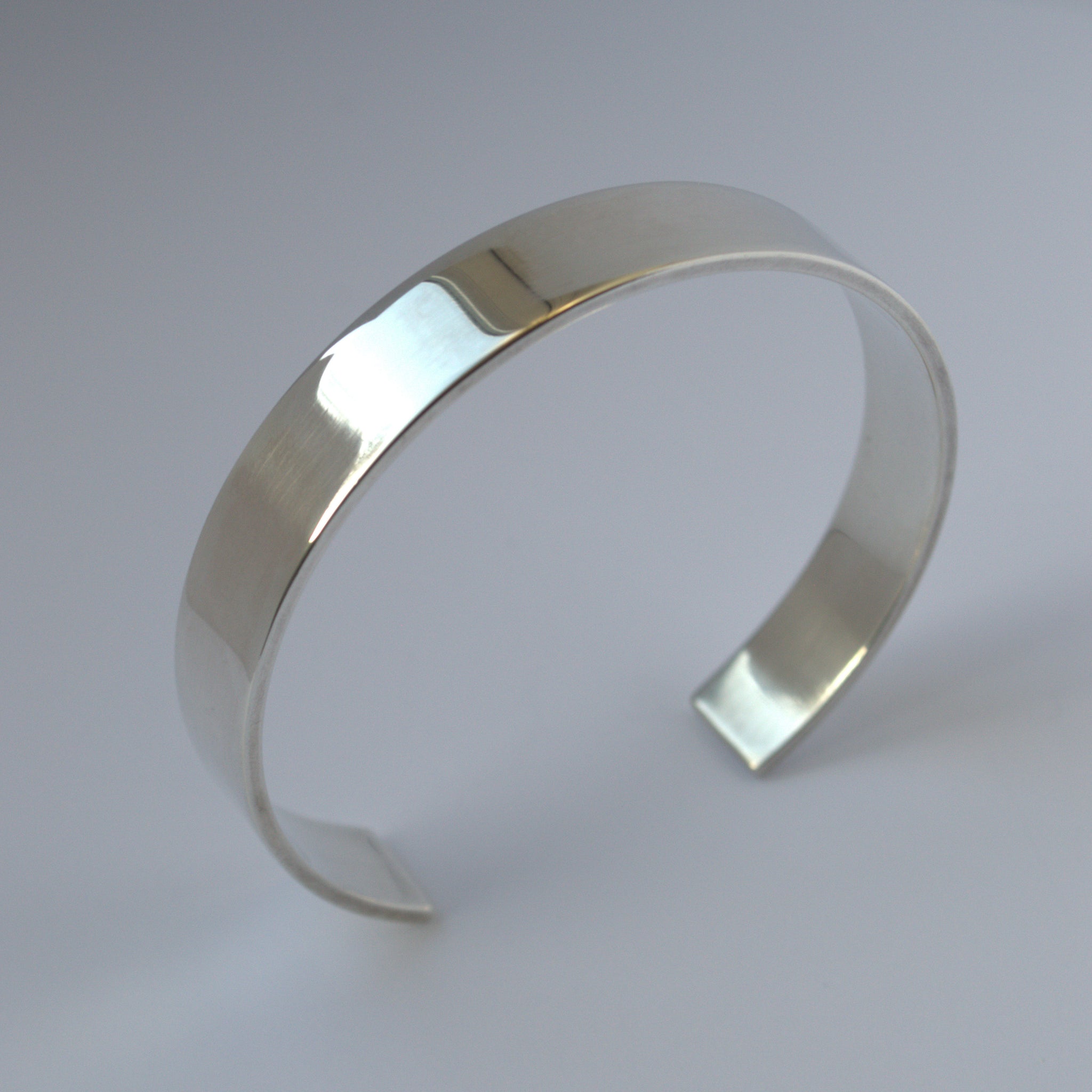 Curvy handmade open cuff silver bangle