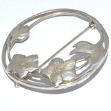 large circular floral brooch