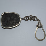 vintage black basalt and silver amulet