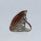 Amber and silver marquise ring