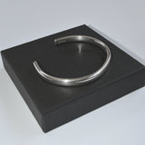 silver oval profile torc bangle on gift box