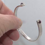 Garnet and silver open bangle