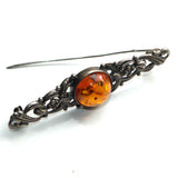 Amber and silver brooch with pin open